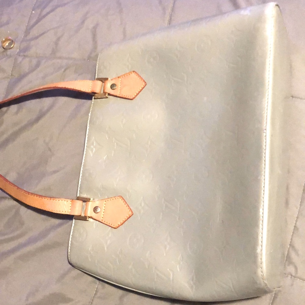 A blue  Louis Vuitton bag perfect for a night out.